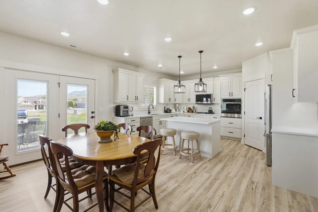 Open-concept great room in a Red Clover Homes custom home in Logan, Utah